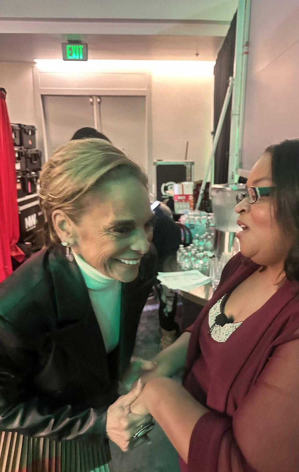 Leisha greeting a guest at USCHA 2026.